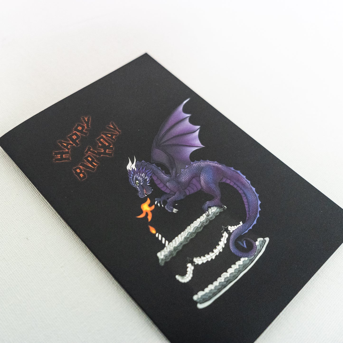 Purple Dragon on cake birthday card close up