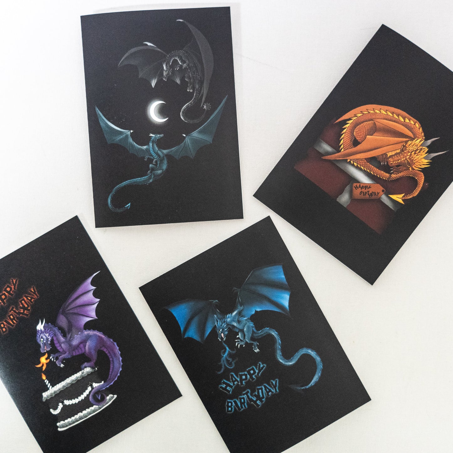 set of four dragon greetings cards