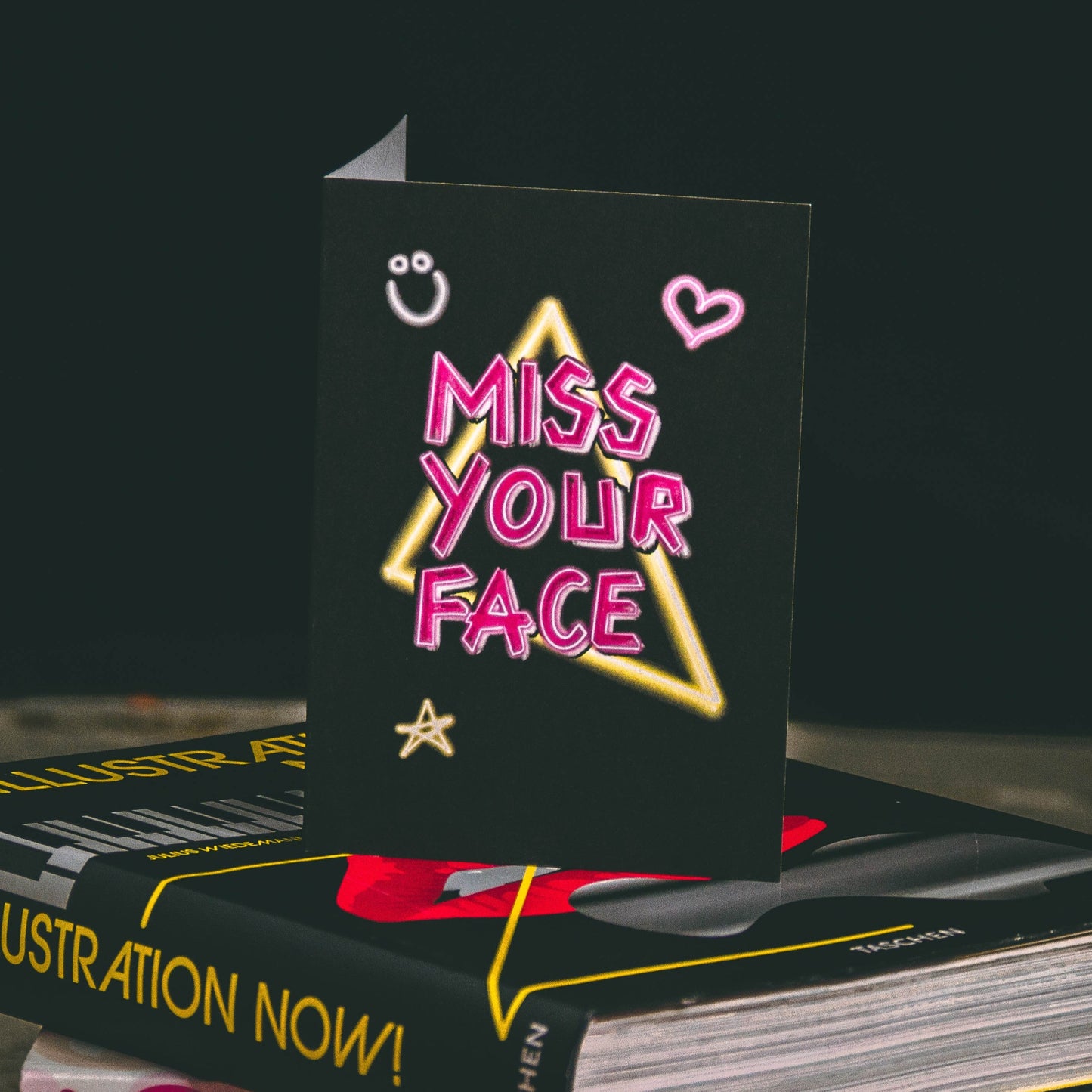 Black A6 Greetings Card with Pink Miss Your Face Neon Slogan Design - By Wayward