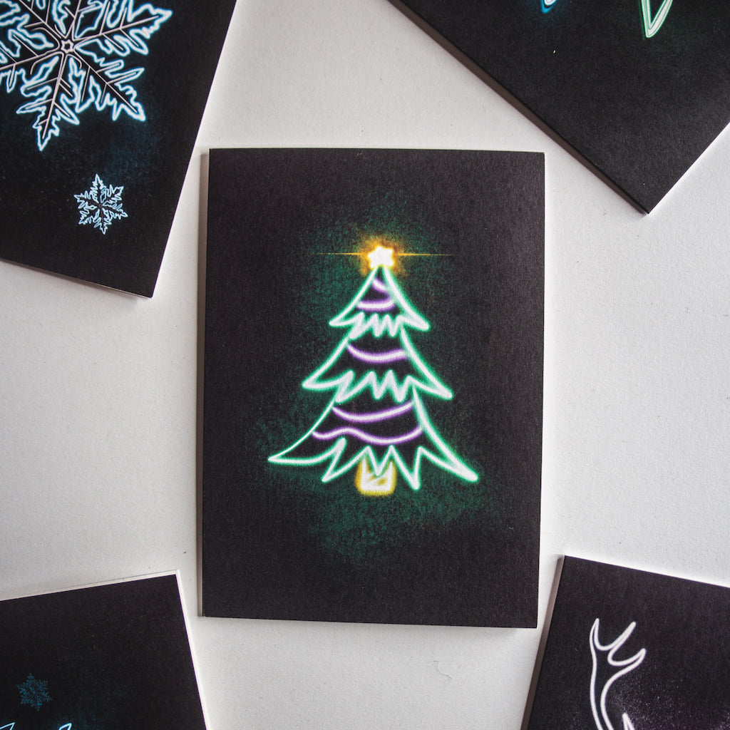 Christmas card by Wayward. Green neon tree on black background