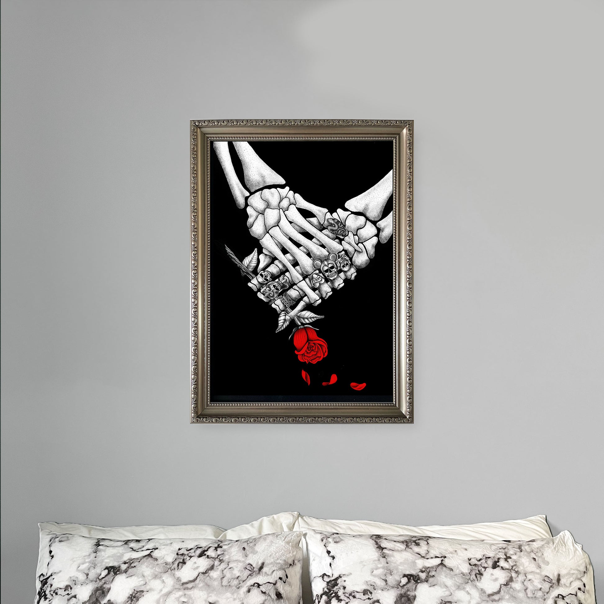 Skeleton with the great frog rings with rose art print above bed - wayward