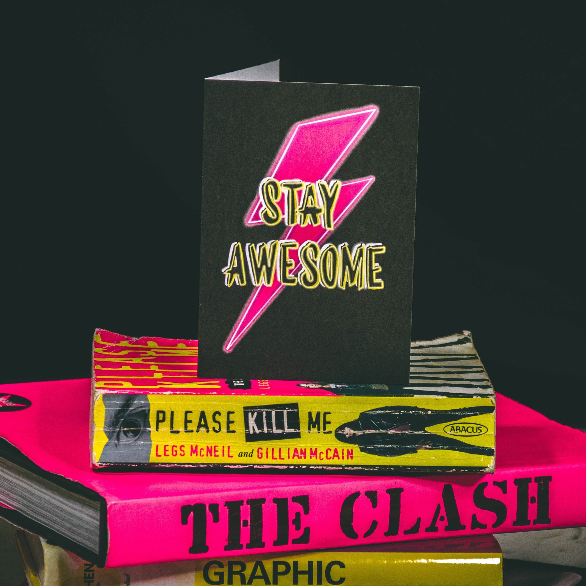 A6 Black Greetings Card With Pink Bowie Lightening Bolt and Stay Awesome Slogan by  Wayward 