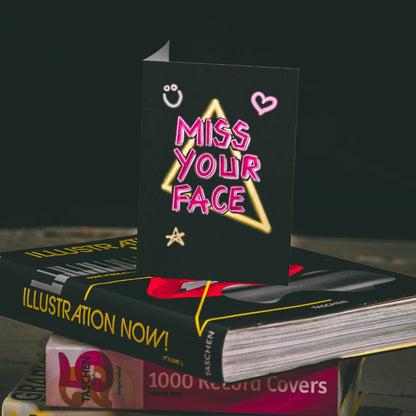 Black A6 Greetings Card with Pink Miss Your Face Neon Slogan Design  - By Wayward