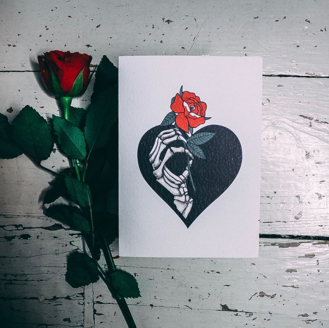 Skeleton Hand Holding red rose illustrated A6 Greetings card by Wayward