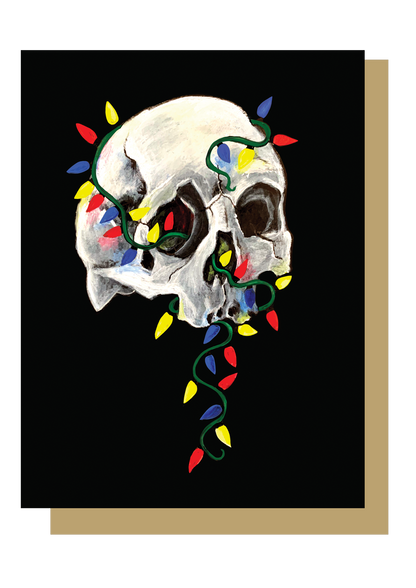 Skull with colorful christmas lights wrapped around on black background. Christmas card by Wayward