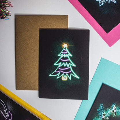 Christmas card by Wayward. Green neon tree on black background